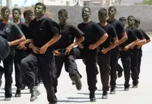 Members of Hamas' security forces march in formation during a graduation ceremony in Gaza